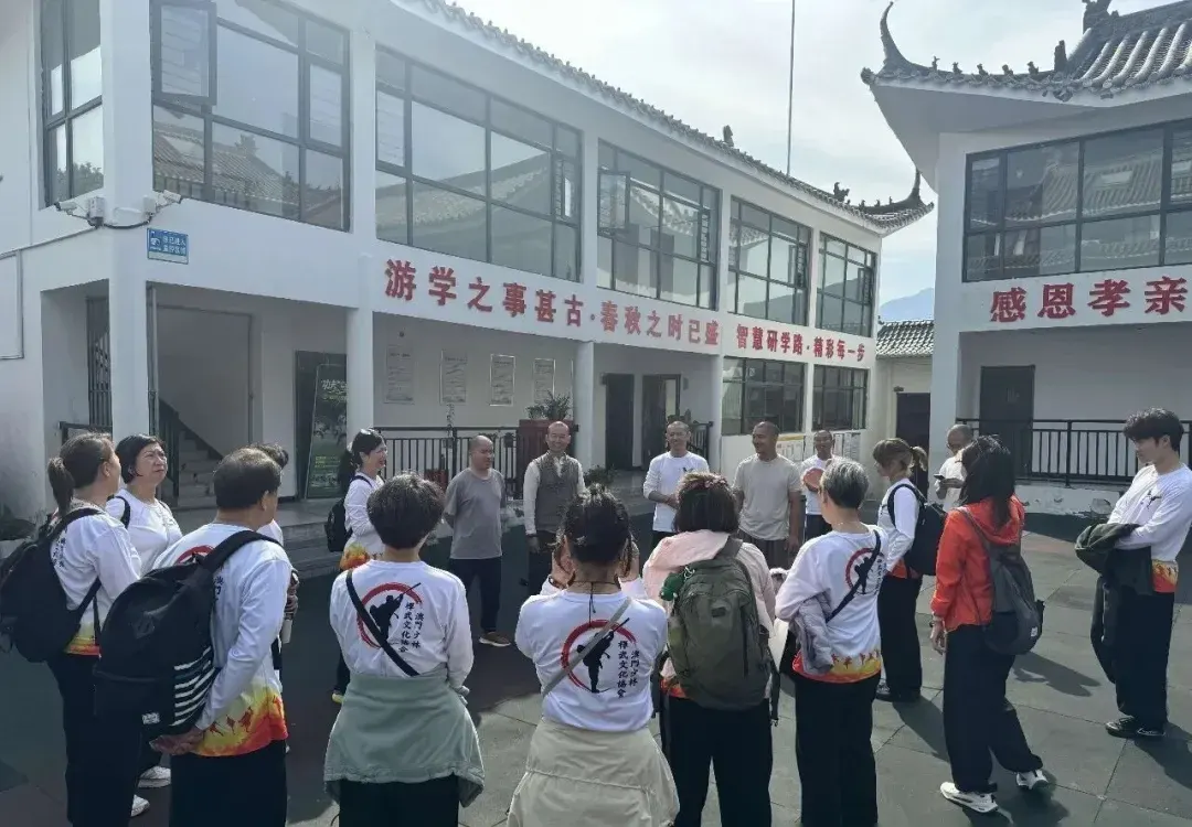 Macao delegation members gathering with Shaolin Zhongwu hosts in the base courtyard