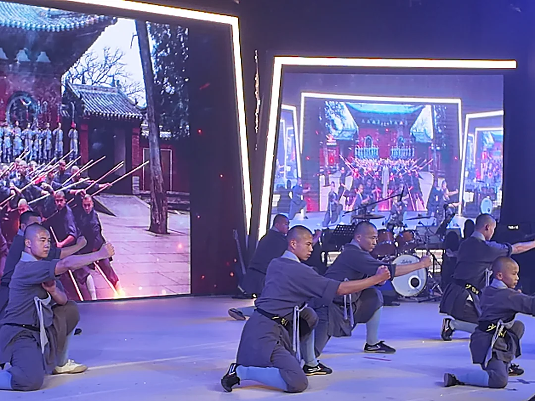 Group Shaolin fist forms performance with Shaolin Temple backdrop in Myanmar