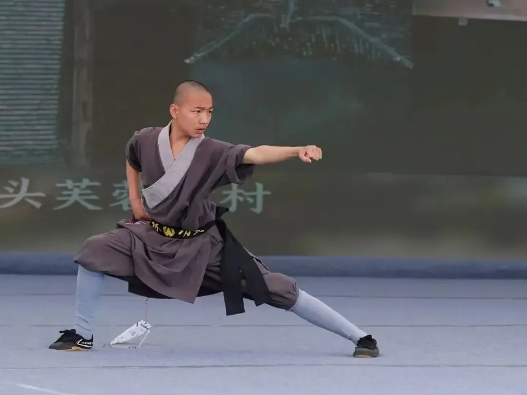 Shaolin Zhongwu student demonstrating fist form at the opening ceremony