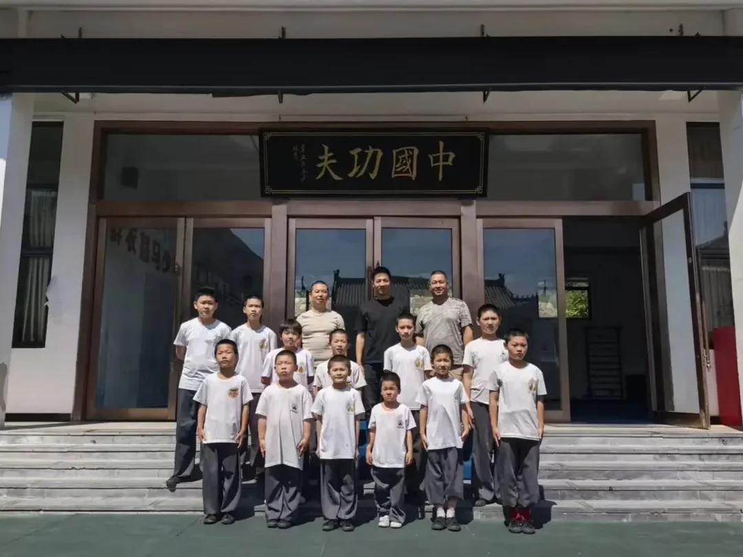 Kung Fu star Wei Wei with Shaolin Zhongwu students at the base entrance